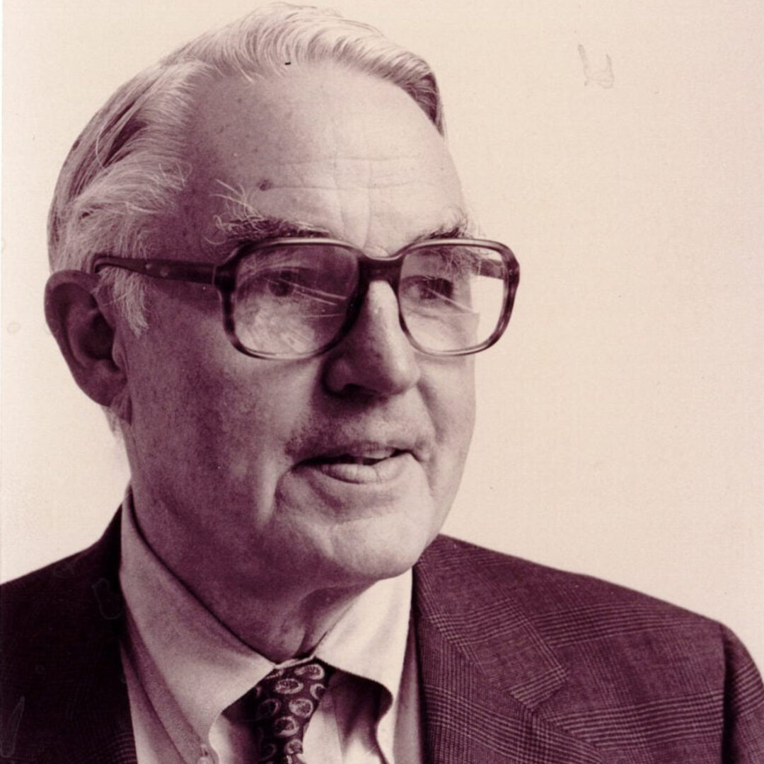 Elderly man with glasses in vintage black and white portrait