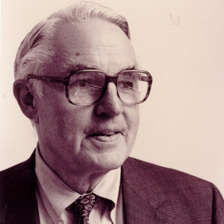Elderly man with glasses in vintage black and white portrait