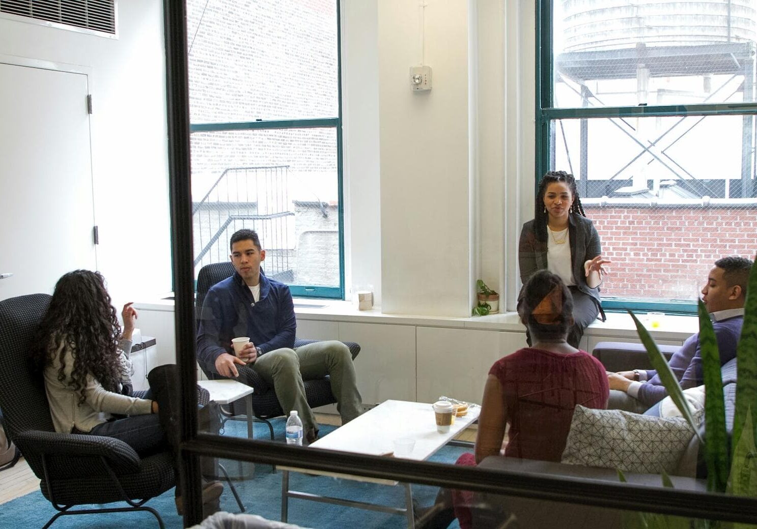 Young professionals having a casual meeting in modern office