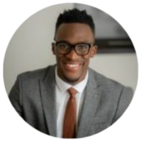 Smiling man in suit and glasses